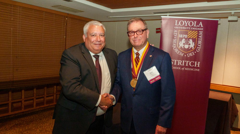 Dean Sam J Marzo presents the 2024 Stritch Medal to Mark E Cichon, DO.